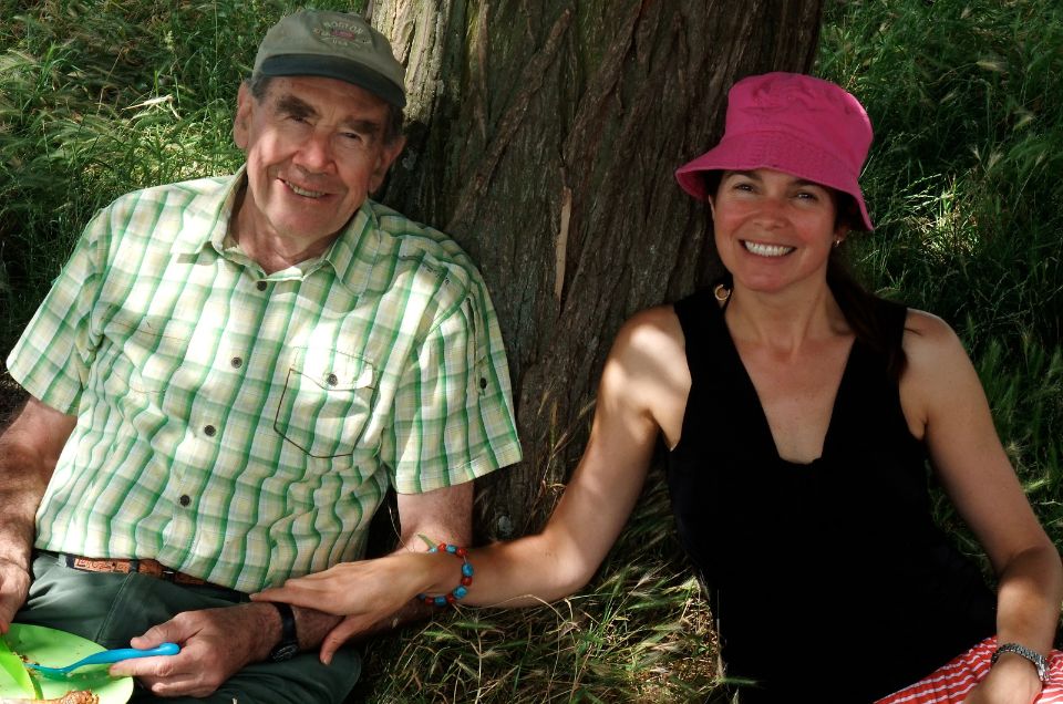 Sir Terence in a green checked shirt with daughter Katharine wearing black, sitting in the sun .jpg