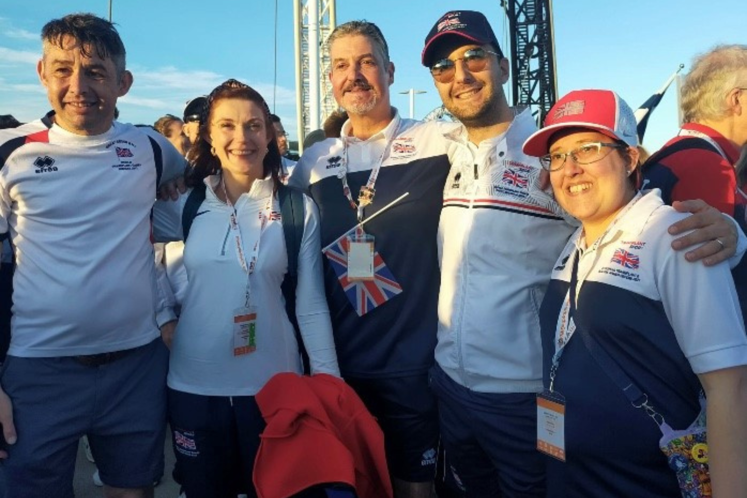 Five World Transplant Games participants standing in a group smiling in their Team GB kit