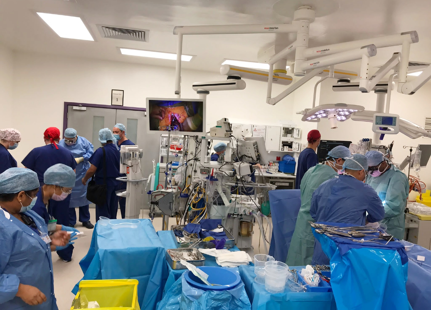 People inside an operating theatre during surgery.