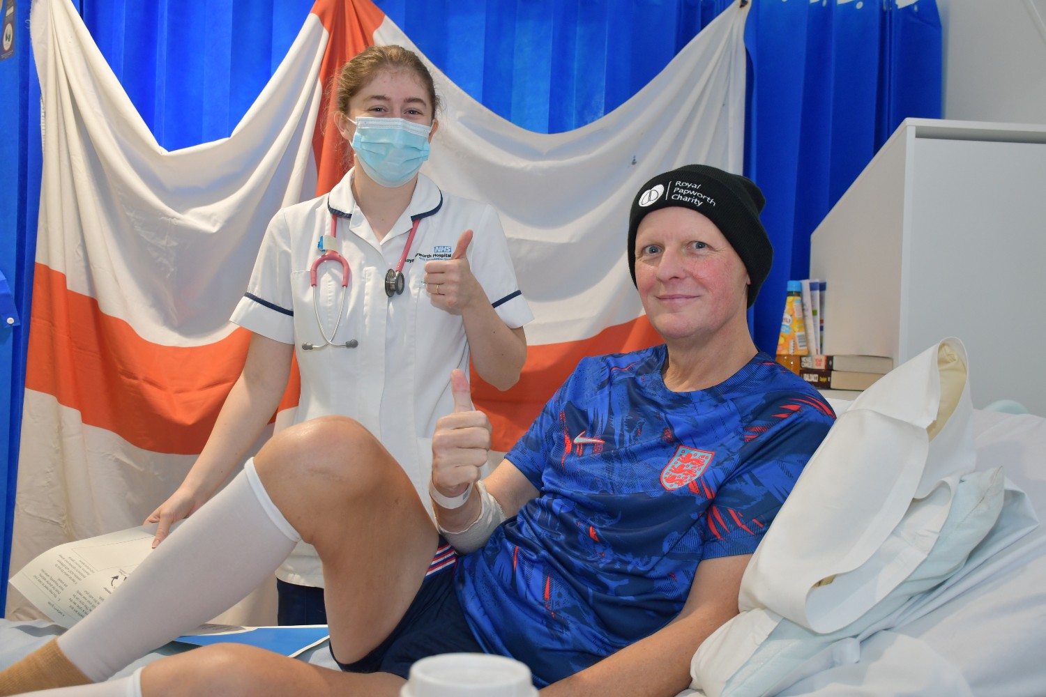 Michael Nash at Royal Papworth Hospital during his recovery from a double lung transplant. He is supported by physio, Florence Edwards, who is in the background